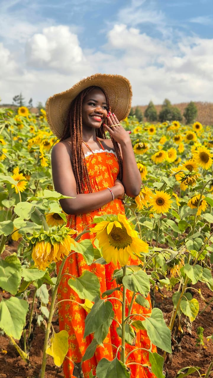 Avanza sunflower muse in an orange dress